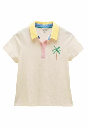 Krēmkrāsas īsroku polo krekls ar dzeltenu apkakli, rozā pogu lenti un izšūtu zaļu palmām uz kreisās krūšu puses.