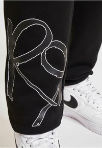 Rocawear Tracksuit bottoms - black