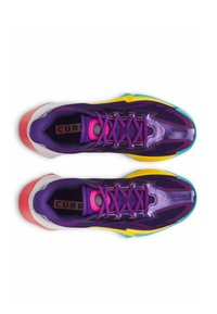 Purple athletic shoes with multicolored accents, textured fabric, pink laces, and a gradient sole. Features a streamlined design.