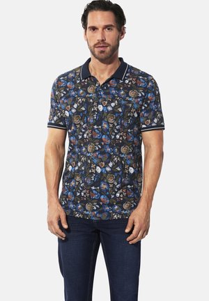 Kurzärmliges, navyblaues Poloshirt mit einem Blumenmuster in Blau, Weiß und Rot. Mit einem Kragen und gestreiften Bündchen. Hergestellt aus Baumwollmischung.