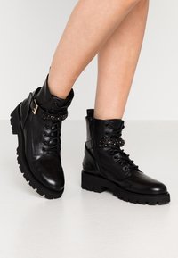 Steven New York Botines camperos - black