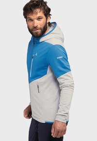 Herren-Outdoormantel mit oberem Teil in Blau mit einer strukturierten Oberfläche und unterem Teil in Hellgrau, einer Kapuze und Reißverschluss-Taschen auf der Brust und an der Seite.
