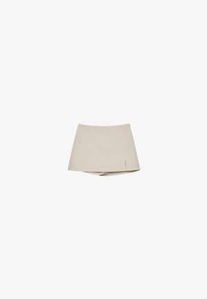 Jupe-culotte beige pour femmes avec une légère fente avant et un short intégré en dessous, présentée sur un fond blanc.