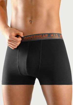 Black boxer briefs made from cotton with a gray elastic waistband, featuring orange lettering "H.I.S UNDERWEAR." Smooth texture and fitted design.