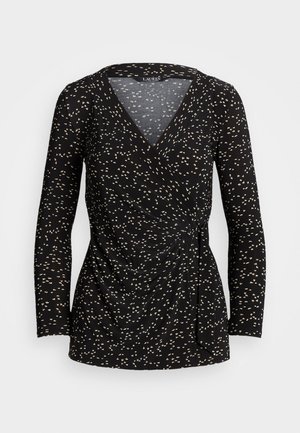 Czarna, długorękawowa bluzka kopertowa z małym białym kwiatowym nadrukiem i detalem z węzłem po boku, dekolt w kształcie litery V oraz dopasowana sylwetka.