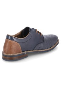 Blue leather shoe with a textured brown heel, round toe, and perforated surface. Features brown laces and white stitching accents.