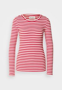 Red and white striped long-sleeve top with a round neckline. Ribbed texture throughout. Label visible at the neckline.
