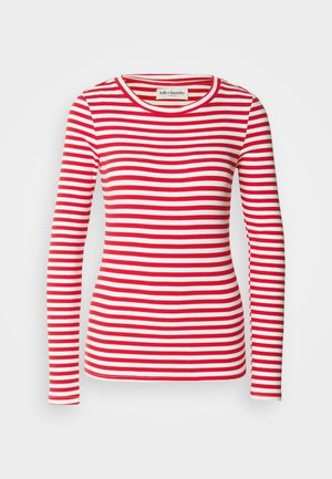 T-shirt de manga longa listrada em vermelho e branco com decote redondo. Textura canelada por toda a peça. Etiqueta visível no decote.