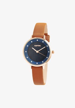Rose gold watch with a dark blue textured face, accented by silver dots. Brown leather strap, round shape, and simple hour markers.