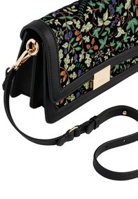 Black leather crossbody bag with floral embroidery in green, orange, and purple. Features a gold hardware clasp and detachable strap.
