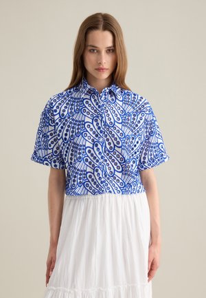 Short-sleeve button-up shirt featuring a blue and white swirling pattern, made of lightweight fabric with a collared neckline and relaxed fit.