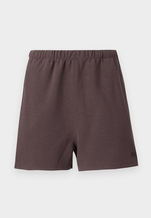 Dark brown shorts made of textured, woven fabric. Features an elastic waistband and a small logo accent on the lower right side.