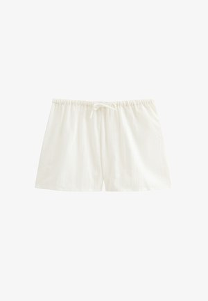 Pantalones cortos de dormir de algodón blanco con cintura elástica y cordón atado al frente, mostrados sobre un fondo blanco liso.