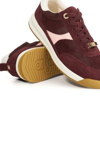 Burgundy suede sneakers with pink accents, cream lining, and a textured rubber sole. Features gold-tone hardware on the laces.