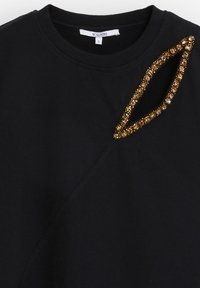 Sudadera negra con un acento texturizado de cuentas doradas en forma de hoja a lo largo del escote. Diseño casual con puños y dobladillo acanalados.