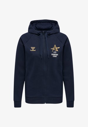 Un sweat à capuche zippé bleu marine en polaire avec un cordon de serrage. Présente des éléments de branding dorés, y compris "EHF" et "CHAMPIONS LEAGUE" sur le devant.
