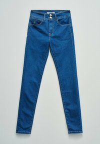 Blue slim-fit jeans with front pockets, double silver buttons, belt loops, and contrast stitching laid flat on a light surface.
