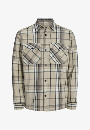 Beżowa flanelowa koszula w kratkę w kolorze ciemno brązowym, jasnobrązowym i białym. Posiada dwie kieszenie na piersi i czarne guziki. Długie rękawy.