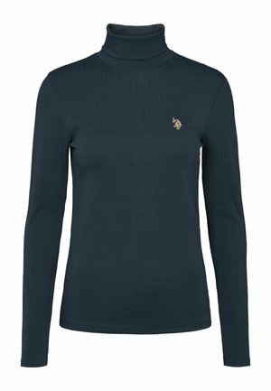 Camiseta de cuello alto de manga larga en un tono azul verdoso oscuro con un pequeño emblema bordado en el lado izquierdo del pecho, presentada sobre un fondo blanco.