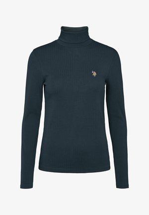 Tumši tīrkīza krāsas ribota garo piedurknju turtlenecks krekls ar nelielu izšūtu emblēmu uz kreisā krūts, attēlots uz balta fona.