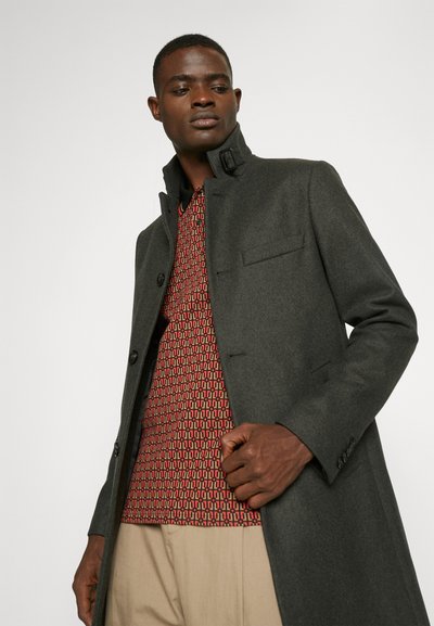 Long grey coat in wool blend with a high collar and button fastening; features a chest pocket and detailed patterned inner lining.