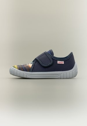 Navy blue children’s shoe with a Velcro strap, white sole, and a colorful pattern on the toe, displayed on a plain background.
