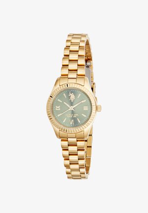 Montre-bracelet en or avec bracelet à maillons, cadran vert, chiffres romains aux positions 3, 6 et 9, et un logo U.S. Polo Assn. à la position 12 heures.