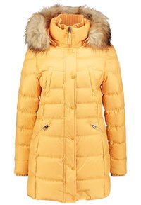 Long yellow padded winter coat with fur-trimmed hood, high collar, front snap buttons, and zippered side pockets.