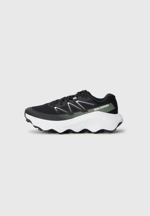 Black athletic shoe featuring a mesh upper, white and light green accents, a cushioned white sole, and a textured grip on the outsole.