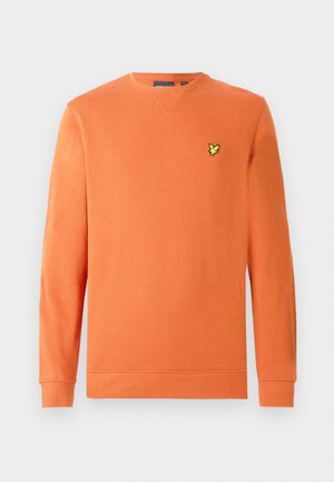 Orange sweatshirt med lange ærmer og ribkant ved ærmerne, med en lille gul logo på brystet. Fremstillet af blødt, tekstureret stof.