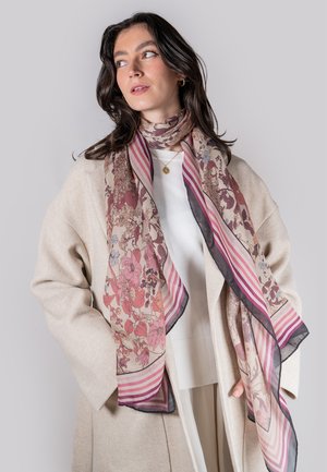 Floral-patterned scarf in soft fabric, featuring shades of pink, cream, and subtle stripes. Edged with dark trim for contrast.