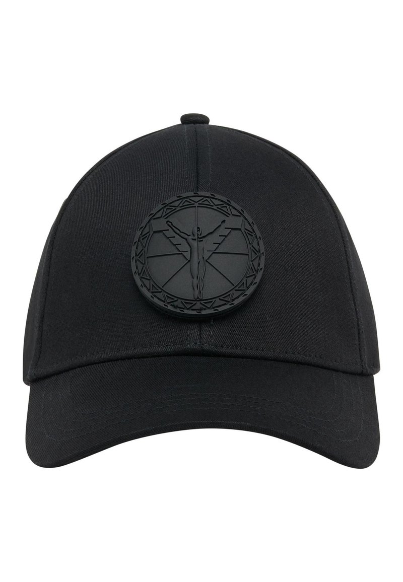 Black baseball cap made from woven fabric. Features a textured black logo patch with an intricate design on the front. Curved visor.