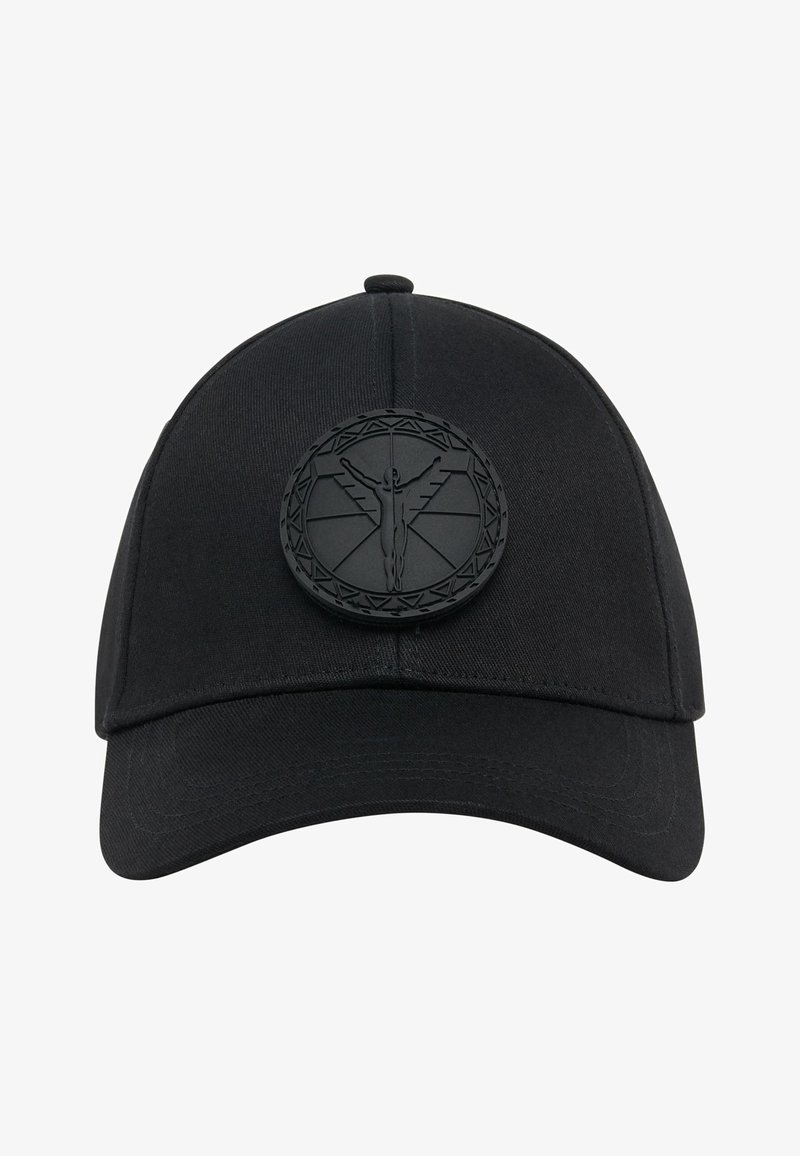 Black baseball cap made from woven fabric. Features a textured black logo patch with an intricate design on the front. Curved visor.