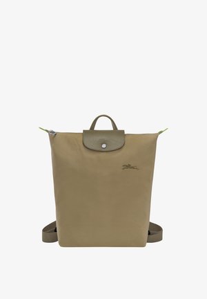 Olive green backpack made of nylon with a leather flap, snap closure, and two adjustable straps. Features a logo and contrasting zipper pull.