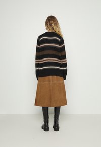 MUNTHE Strickpullover - black