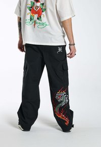 Ed Hardy - FLAMES COMBAT - Trousers - black Thumbnail Image 1