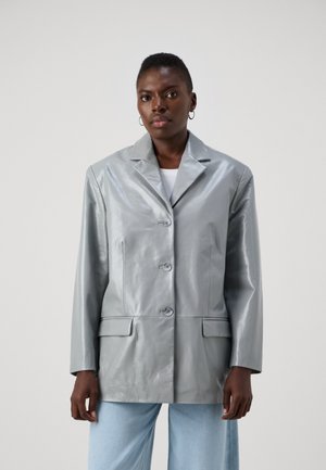 Silver, glossy faux leather jacket with a notch lapel, three front buttons, two patch pockets, and long sleeves.