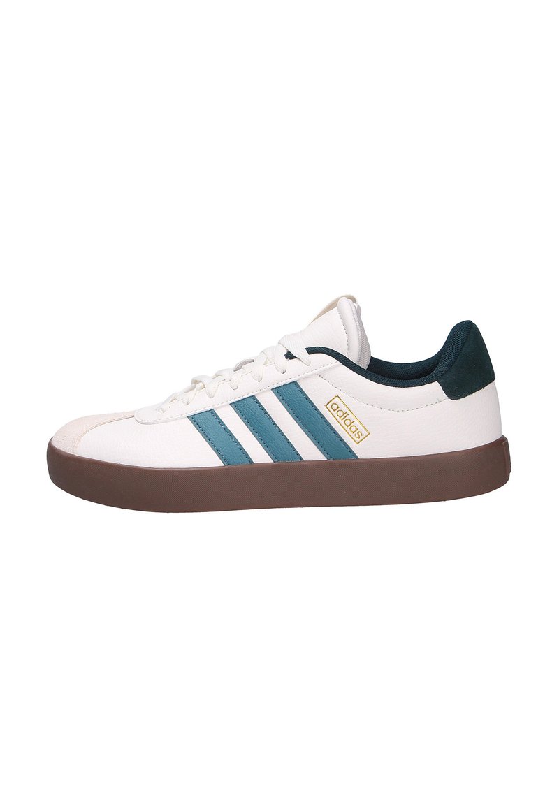 White sneakers with teal stripes, brown rubber sole, and a textured upper. Features a gold logo and a dark green heel accent.