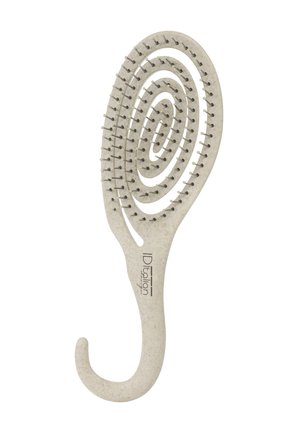Brosse à cheveux ovale beige avec un design en spirale ouverte et des poils flexibles, avec un manche incurvé portant le logo ID Italian Beauty.