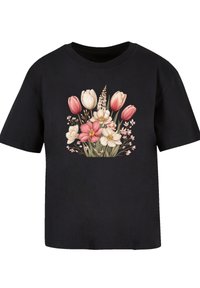 Black short-sleeve t-shirt featuring a floral print with pink and white tulips, green stems, and delicate pink accents.