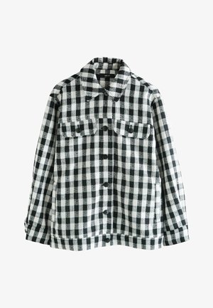 Juoda ir balta languota flanelinė striukė su sagų užsegimu, dviem krūtinės kišenėmis ir smailėjančiu apykakliu. Minkšta tekstūra, laisva forma.