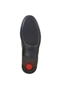 Zwarte schoenzool met een textuurpatroon voor grip, cirkelvormige rode accent en ronde puntontwerp. Duurzaam materiaal met een gladde afwerking.