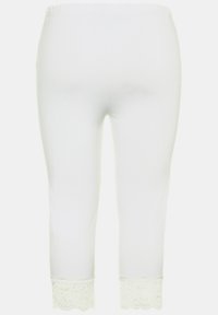 Leggings capri bianchi realizzati in materiale morbido, con un delicato bordo in pizzo all'orlo. Vita elastica per una vestibilità comoda.