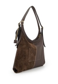 Brown leather shoulder bag with suede accents, curved shape, dual straps, gold hardware, and decorative stitching. Zipper pocket on side.