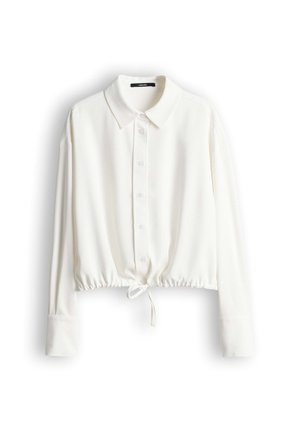 White long-sleeve shirt with a button-down front, spread collar, elasticized waist, and ties, made of a smooth, lightweight fabric.