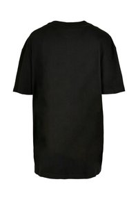 Black cotton t-shirt with a relaxed fit, short sleeves, round neckline, and a straight hem. No visible logos or patterns on the back.