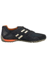 Sport sneaker in navy blue and cream with mesh and suede materials. Features orange accents, a low-profile design, and textured rubber sole.