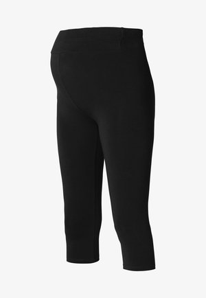 Leggings capri negros hechos de una tela elástica y suave; cuentan con una cinturilla ancha y sin costuras, y un diseño ajustado.