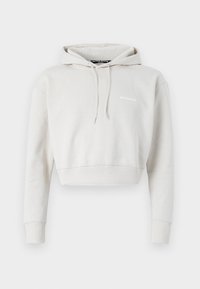 Cropped hoodie in light gray fabric featuring a drawstring hood, ribbed cuffs, and a small logo on the chest. Soft, textured material.