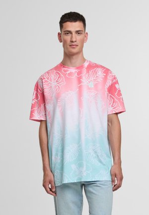 Short-sleeve t-shirt featuring a gradient from pink to light blue with white floral patterns. Made of soft fabric, crew neck design.